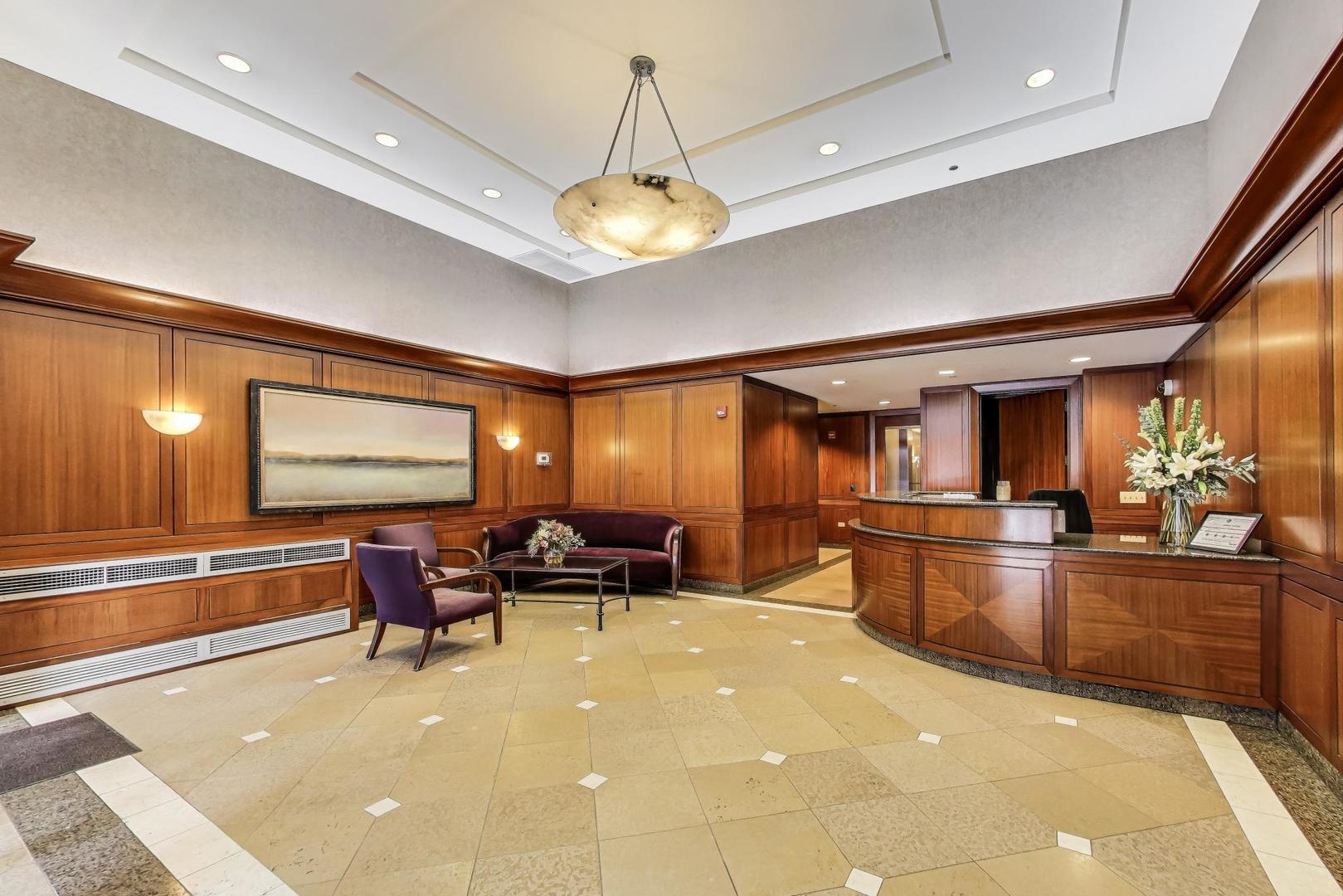 635 North Dearborn Street, Unit 2104 Chicago, IL 60654 - Photo 3 of 29 a lobby with furniture and chandelier