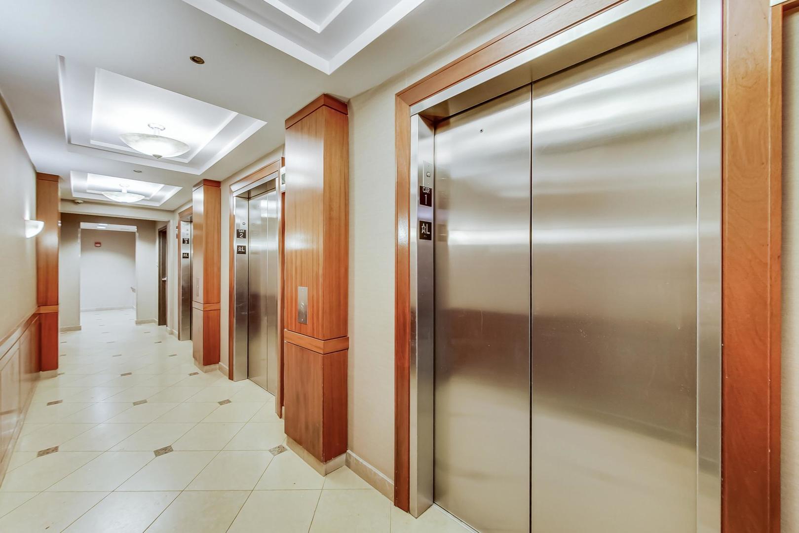 635 North Dearborn Street, Unit 2104 Chicago, IL 60654 - Photo 4 of 29 a bathroom with a shower and a mirror