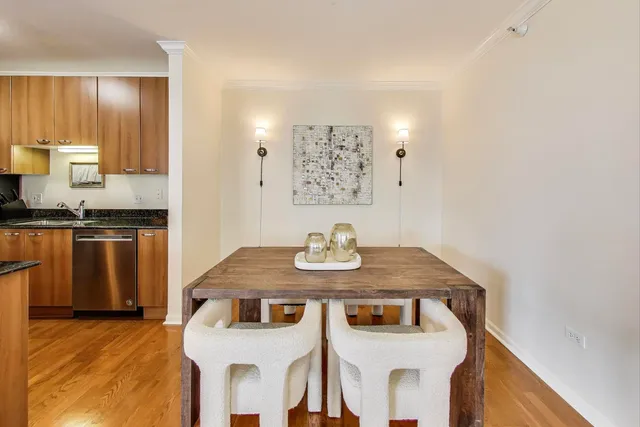 a kitchen with stainless steel appliances granite countertop a sink a stove and refrigerator