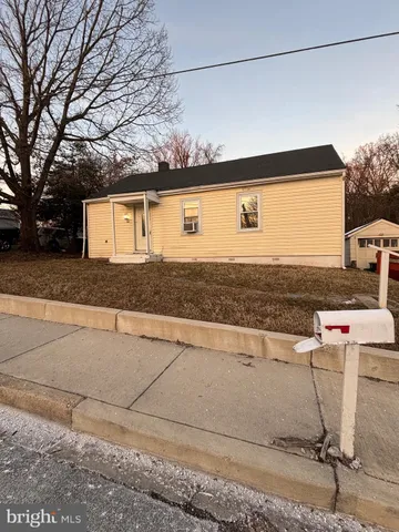 a front view of a house with yard