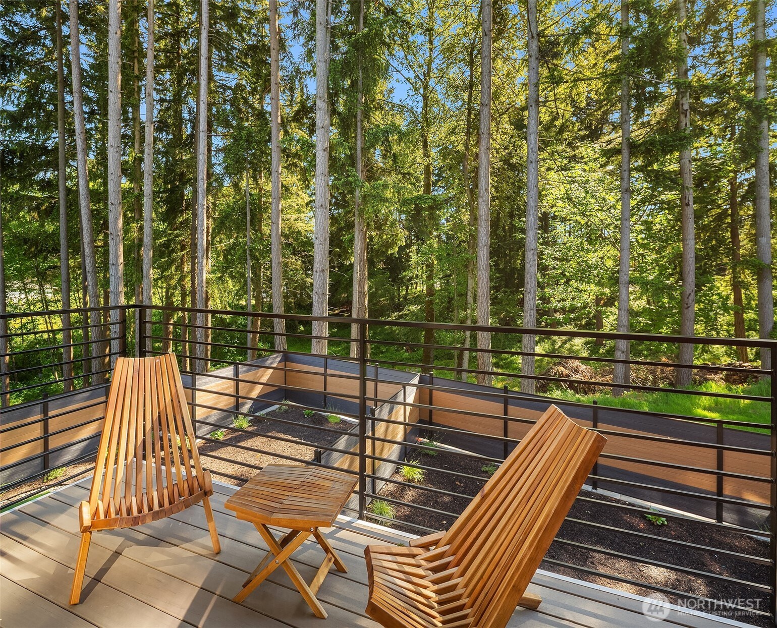 19722 Filbert Drive, Unit 9 Bothell, WA 98012 - Photo 13 of 35 a view of a balcony with wooden floor and iron fence