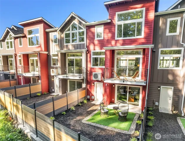 a front view of a residential apartment building with a yard