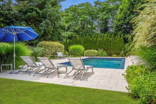 a view of a chairs and table in the patio