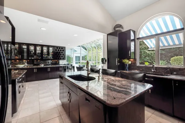 a kitchen with sink a counter top space and appliances