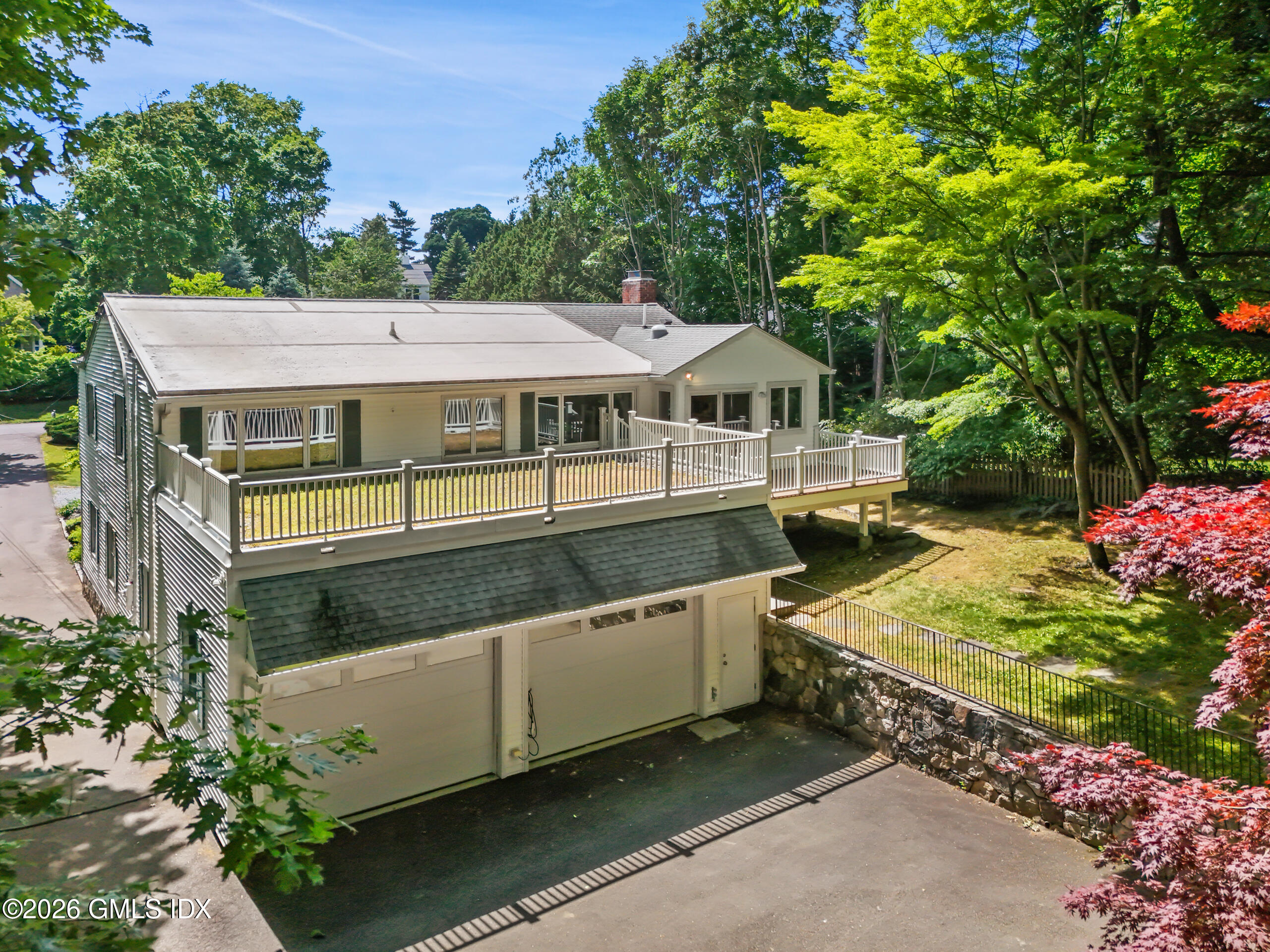 33 Sachem Road Greenwich, CT 06830 - Photo 27 of 35 an aerial view of a house with a yard balcony and outdoor seating
