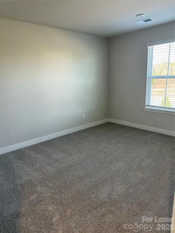 an empty room with closet area