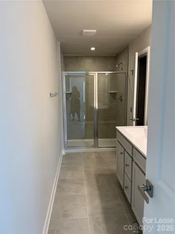 a white toilet and tub sitting next to a bathroom sink