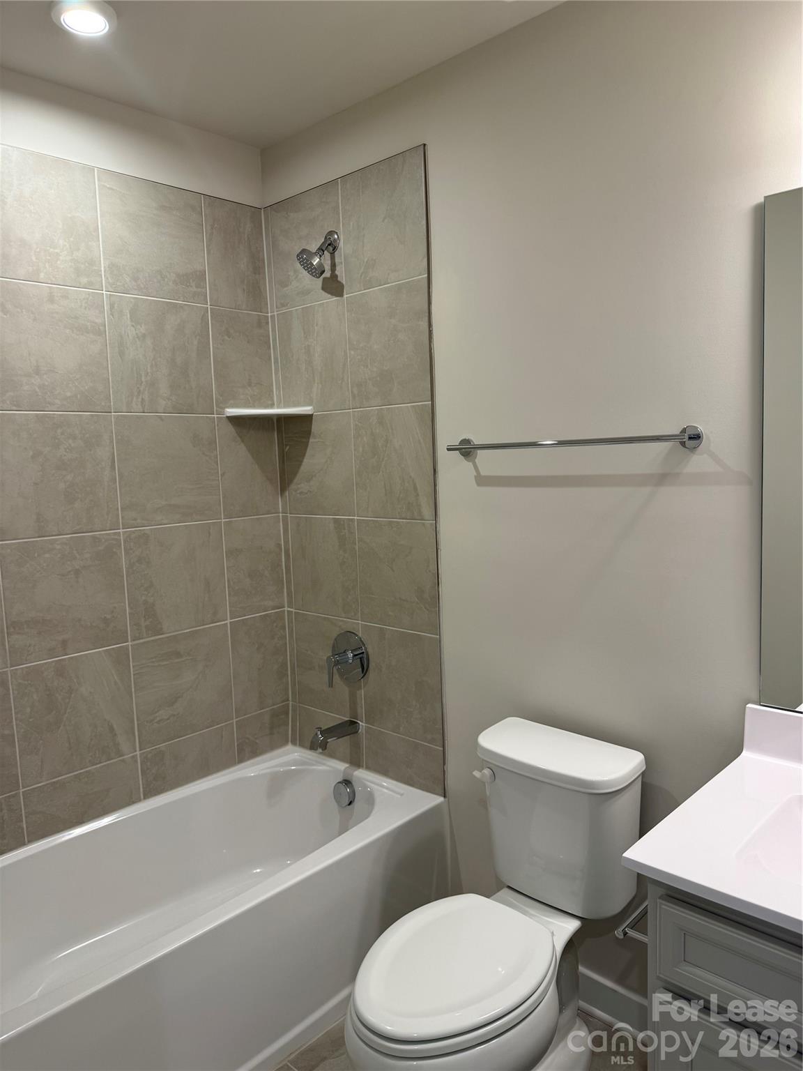 1654 Respect Street Northwest Concord, NC 28027 - Photo 18 of 19 a white toilet and tub sitting next to a bathroom sink