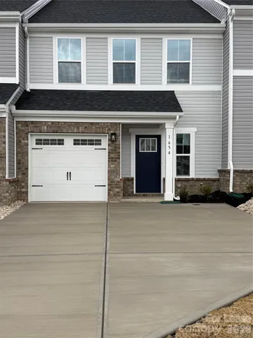 a view of a house with a parking space