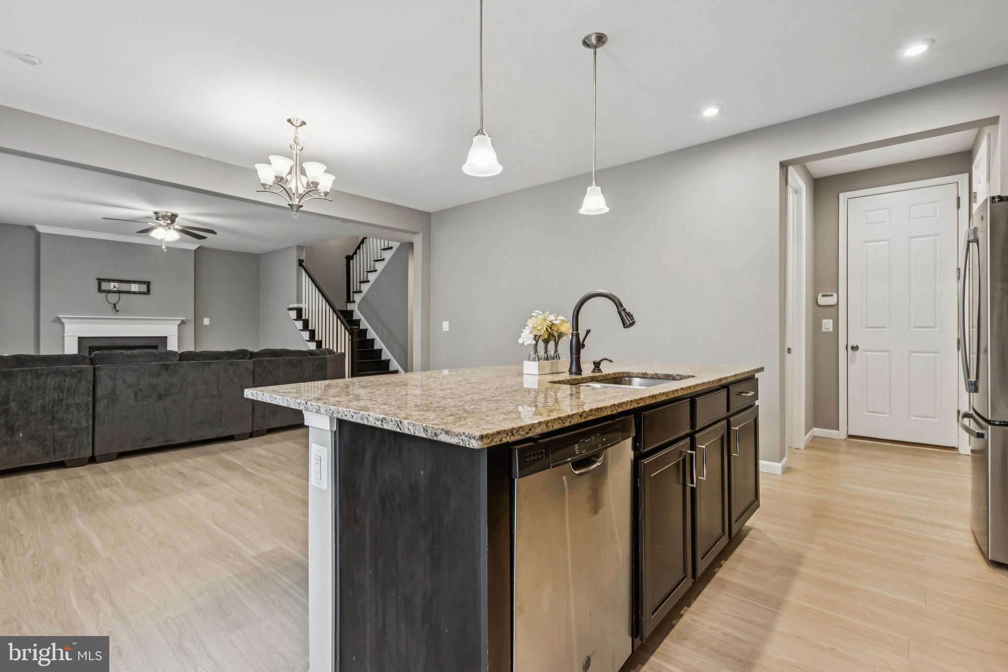 7252 Liberty Court Ruther Glen, VA 22546 - Photo 14 of 45 a kitchen with center island a sink stainless steel appliances and cabinets