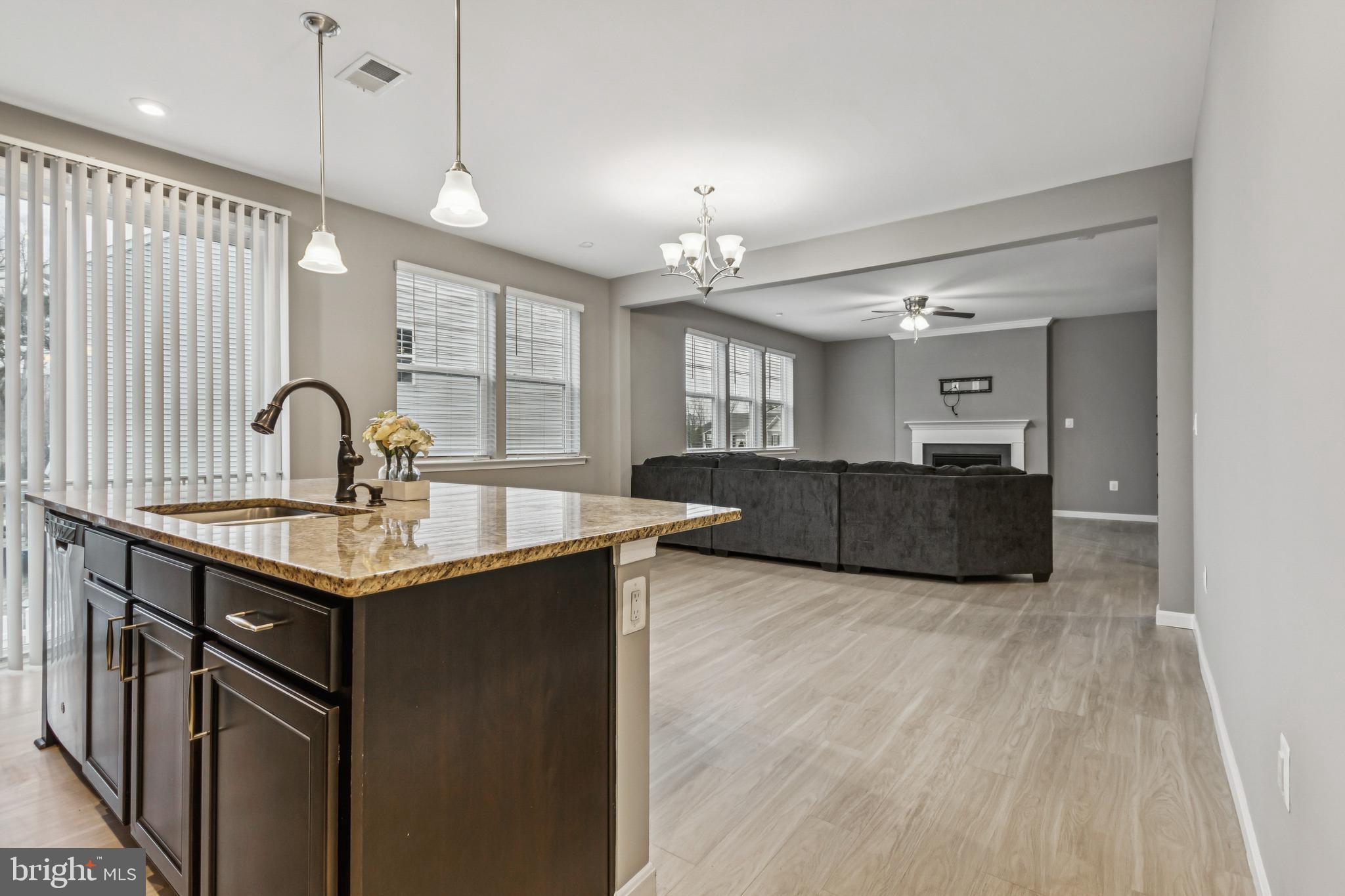 7252 Liberty Court Ruther Glen, VA 22546 - Photo 15 of 45 a kitchen with granite countertop a sink cabinets and window