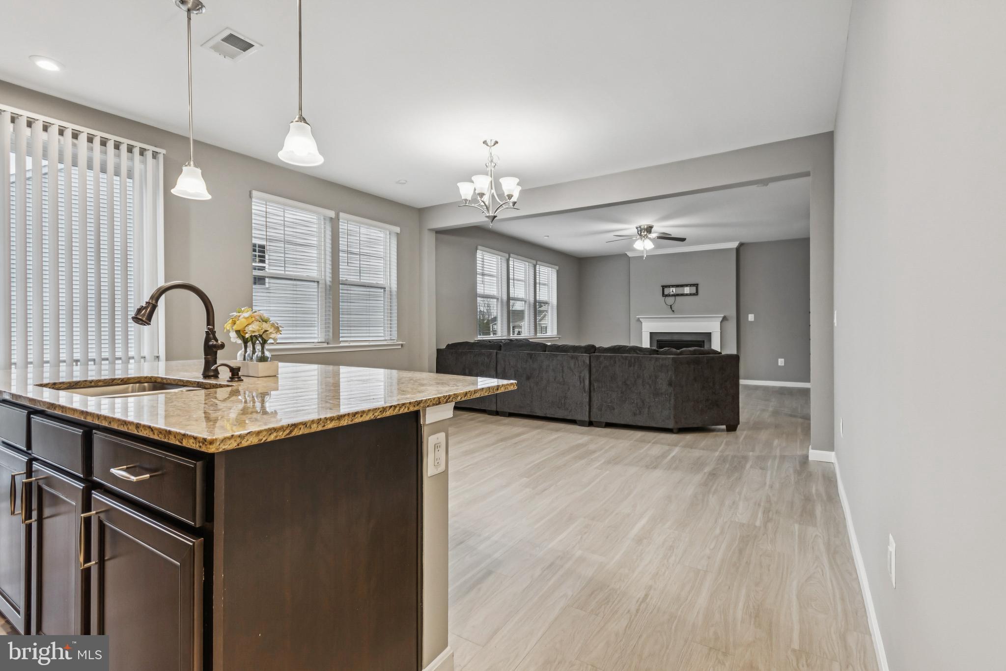 7252 Liberty Court Ruther Glen, VA 22546 - Photo 16 of 45 a kitchen with stainless steel appliances granite countertop a sink a stove and a wooden floors