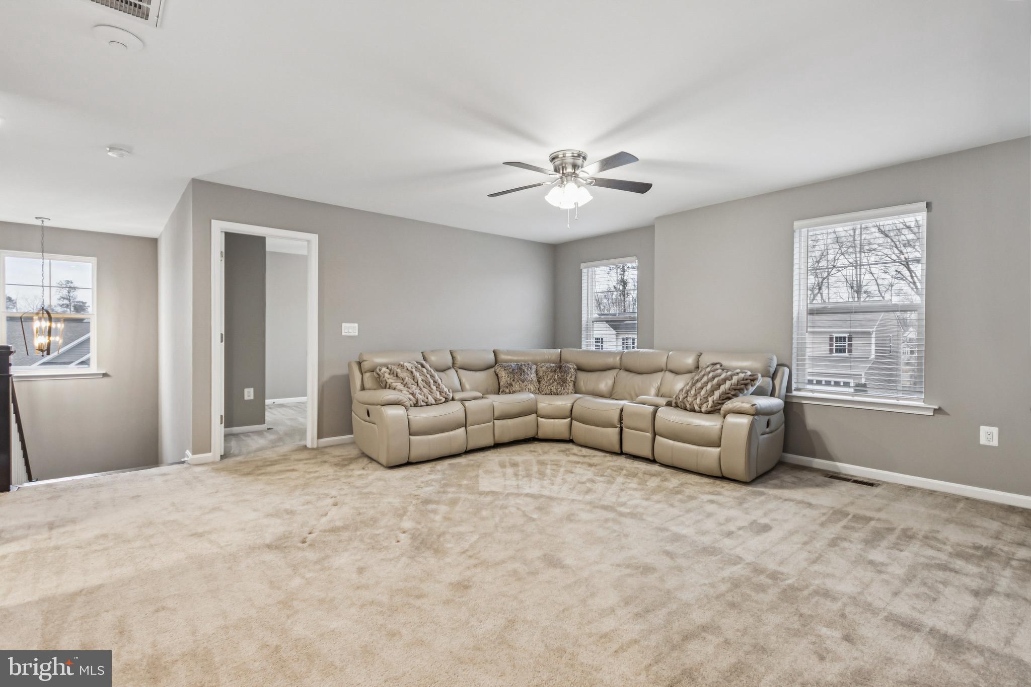 7252 Liberty Court Ruther Glen, VA 22546 - Photo 21 of 45 a living room with furniture and a ceiling fan
