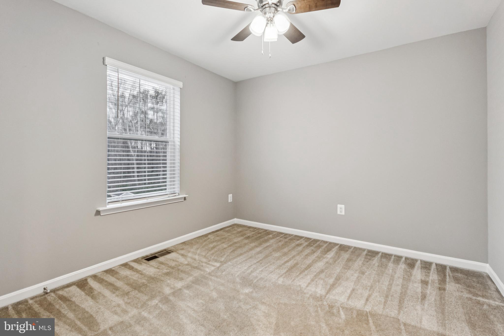 7252 Liberty Court Ruther Glen, VA 22546 - Photo 24 of 45 a view of an empty room with a window