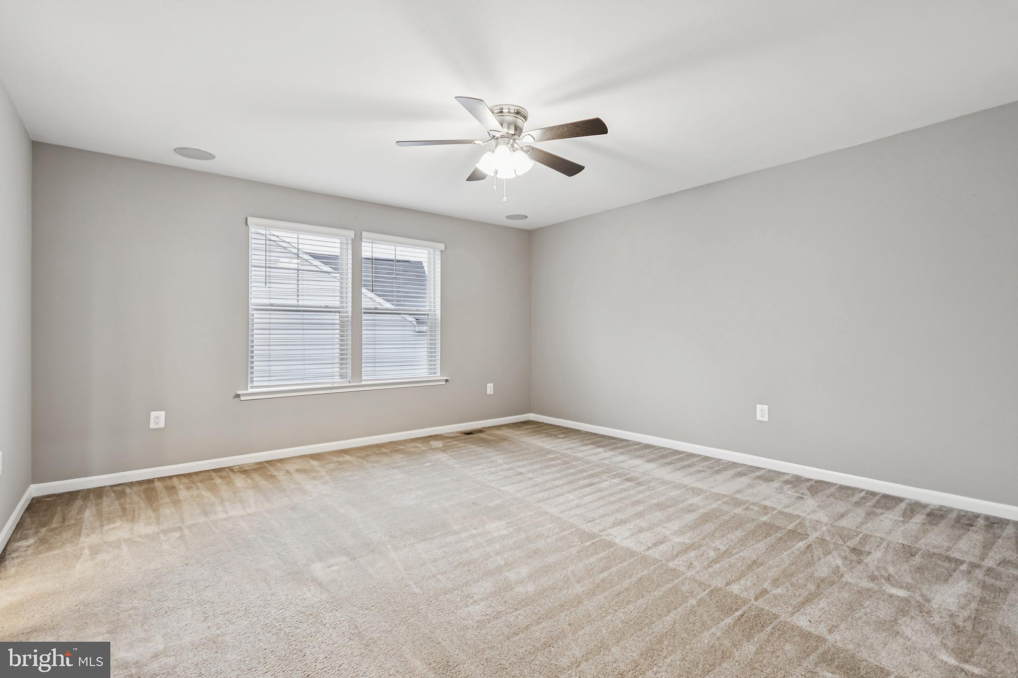 7252 Liberty Court Ruther Glen, VA 22546 - Photo 29 of 45 an empty room with windows and fan