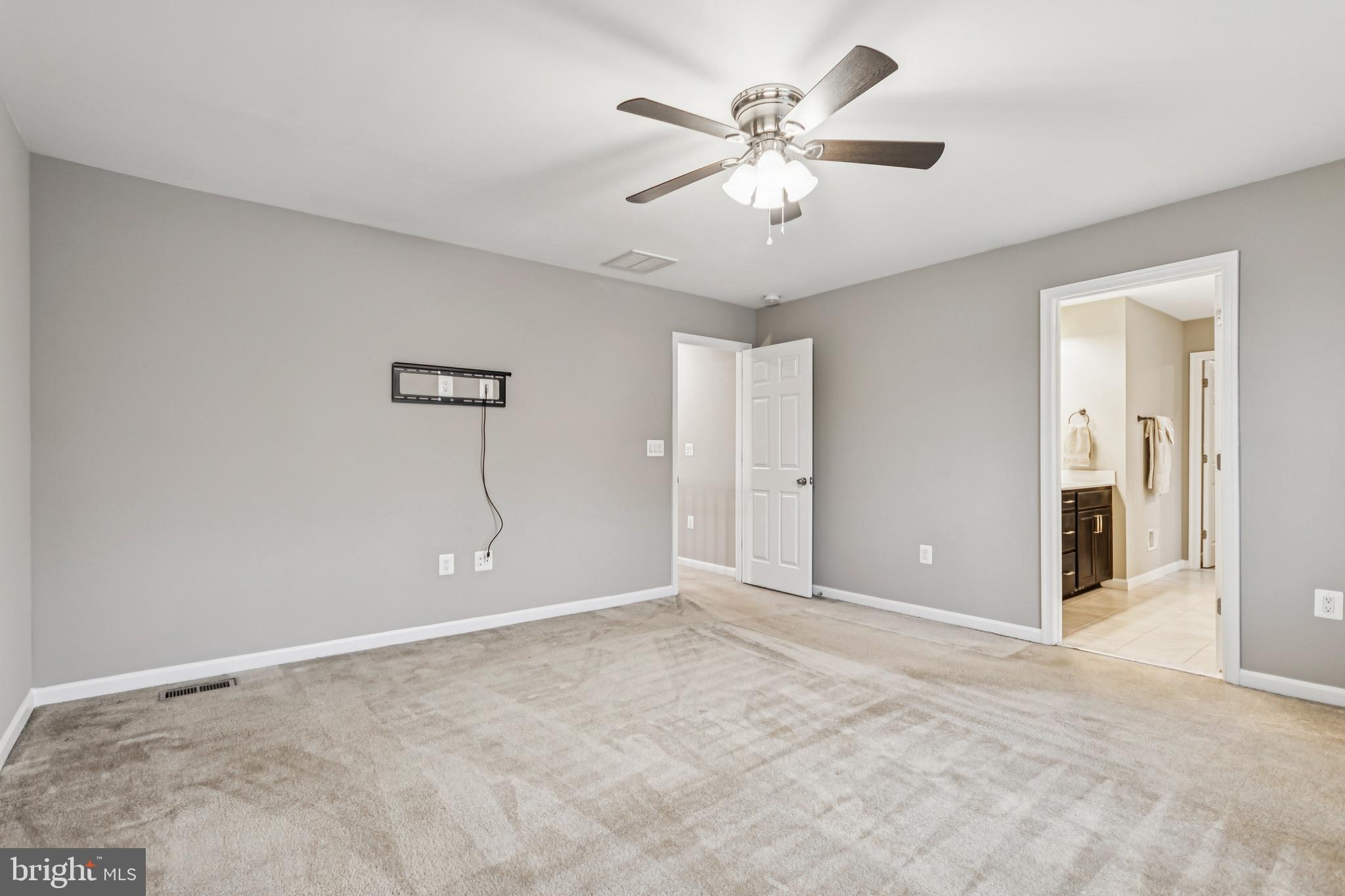 7252 Liberty Court Ruther Glen, VA 22546 - Photo 30 of 45 a view of an empty room with chandelier fan