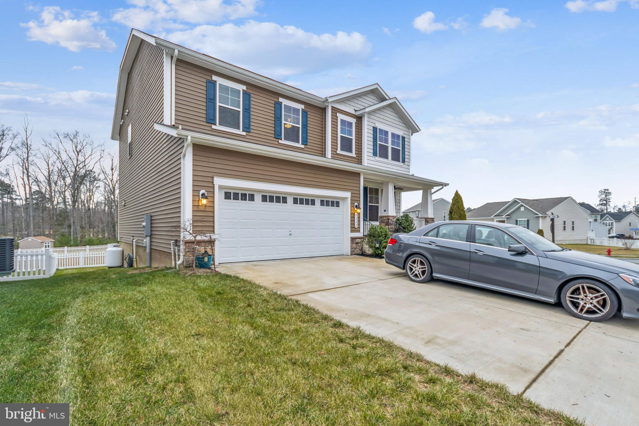 7252 Liberty Court Ruther Glen, VA 22546 - Photo 3 of 45 a car parked in front of a house