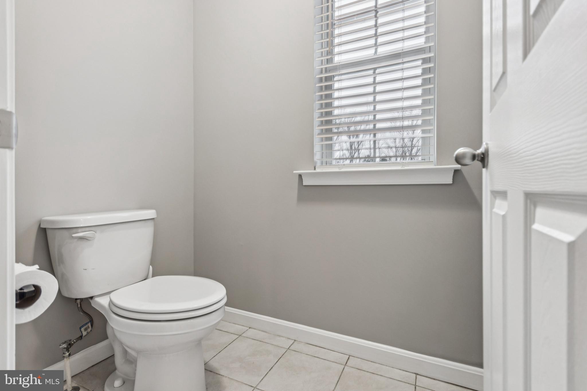 7252 Liberty Court Ruther Glen, VA 22546 - Photo 32 of 45 a white toilet sitting next to a window in a bathroom
