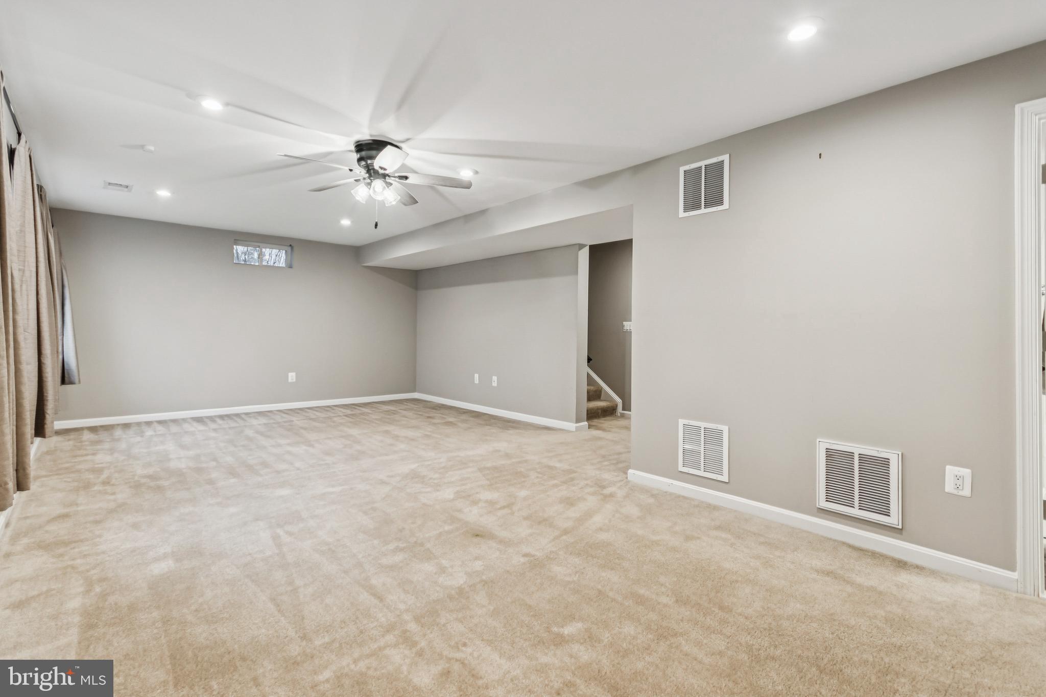 7252 Liberty Court Ruther Glen, VA 22546 - Photo 36 of 45 a view of an empty room with a ceiling fan