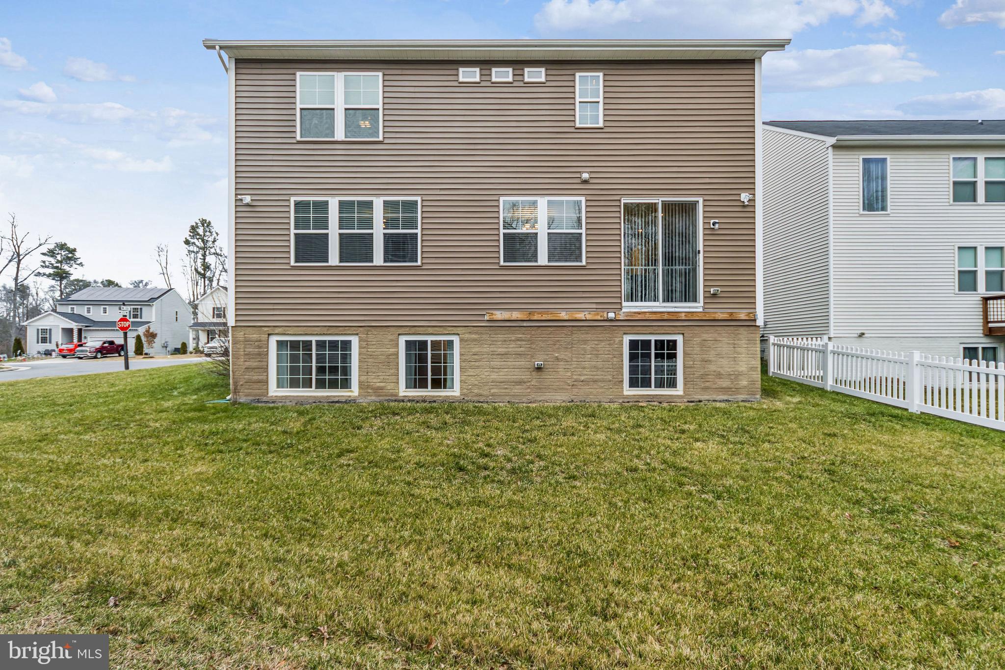 7252 Liberty Court Ruther Glen, VA 22546 - Photo 42 of 45 a brick house that has a lots of windows in it