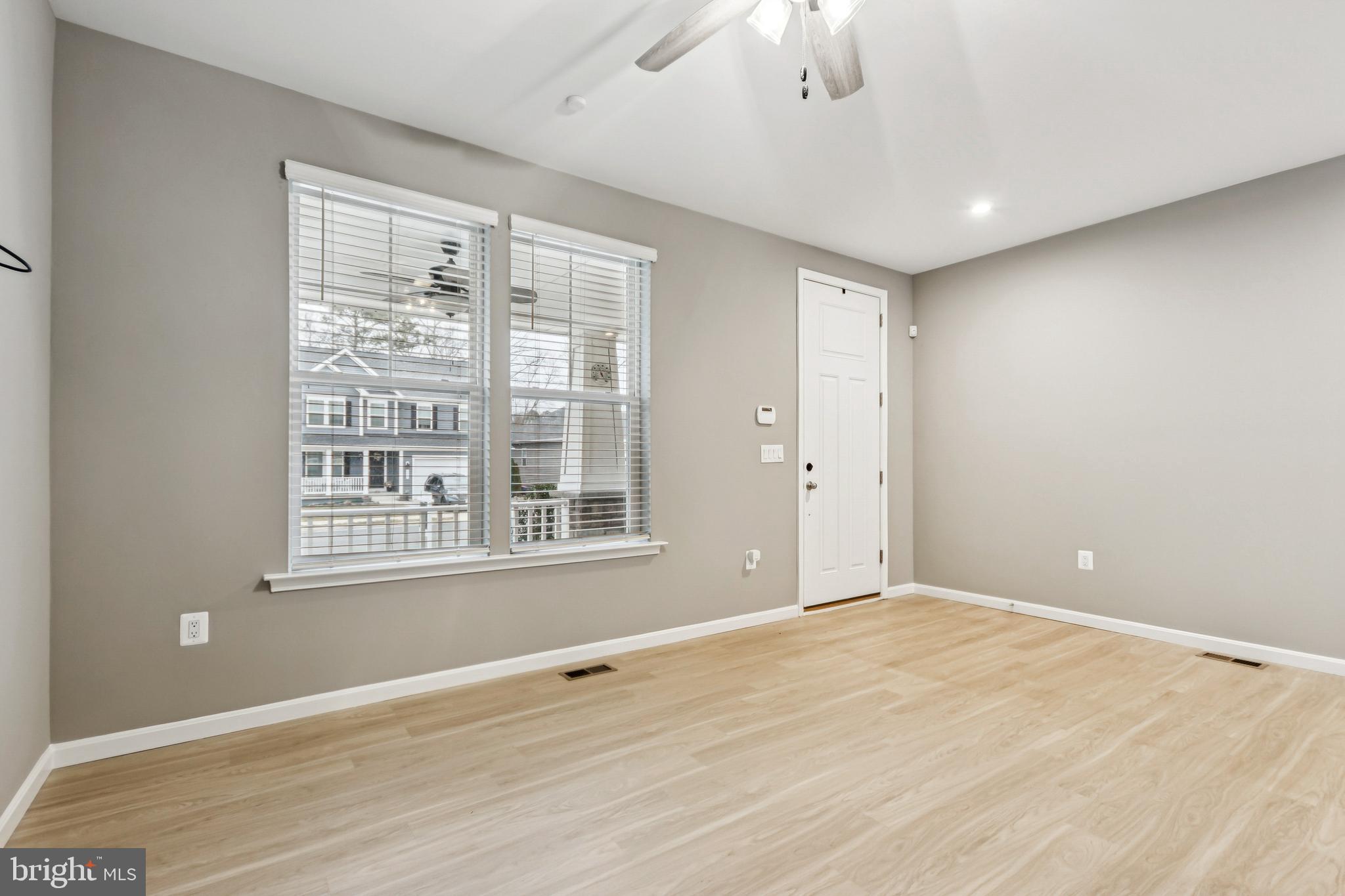 7252 Liberty Court Ruther Glen, VA 22546 - Photo 8 of 45 a view of an empty room with wooden floor and a window