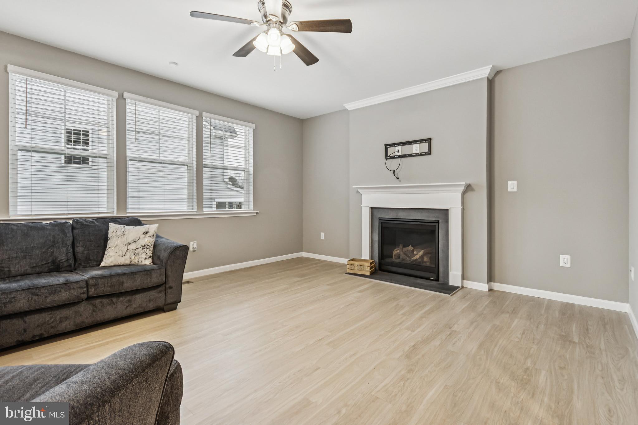 7252 Liberty Court Ruther Glen, VA 22546 - Photo 10 of 45 a living room with furniture and a fireplace