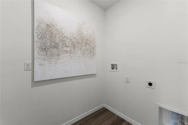 a view of a small space with wooden floor in it