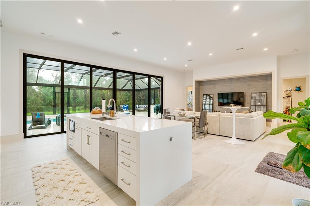 2991 2nd Street Northwest Naples, FL 34120 - Photo 15 of 43 a large white kitchen with a large window