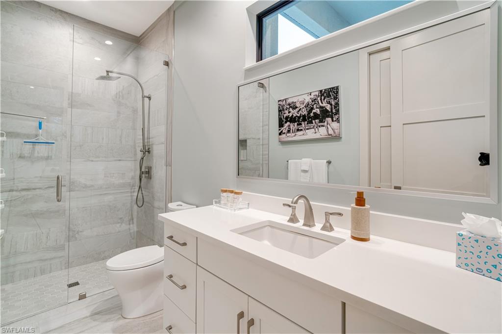 2991 2nd Street Northwest Naples, FL 34120 - Photo 28 of 43 a bathroom with a sink a toilet and shower