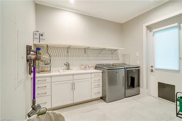 a utility room with washer and dryer