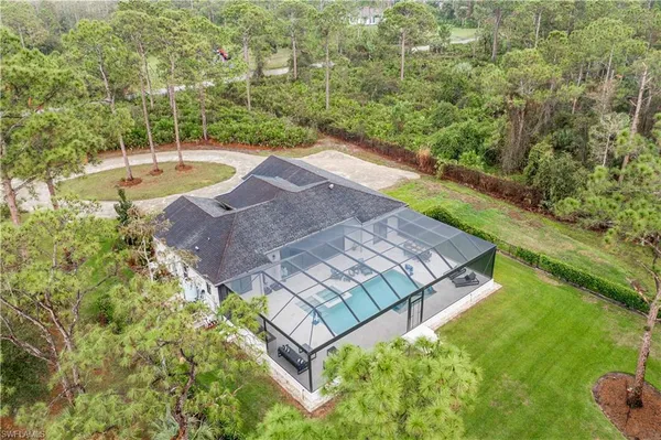 a view of a backyard with side of the road