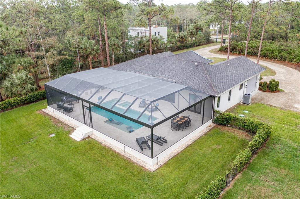 2991 2nd Street Northwest Naples, FL 34120 - Photo 4 of 43 a view of a patio with a yard