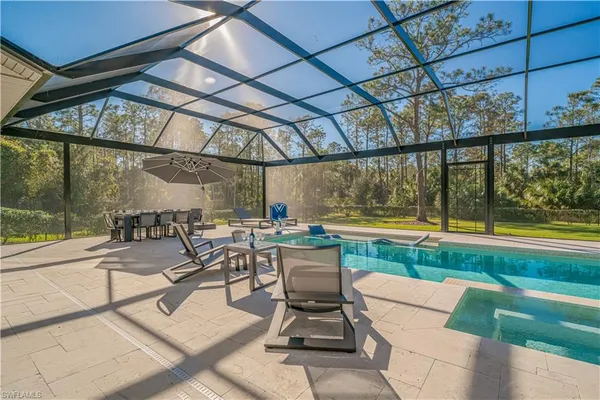 a view of a swimming pool with a patio