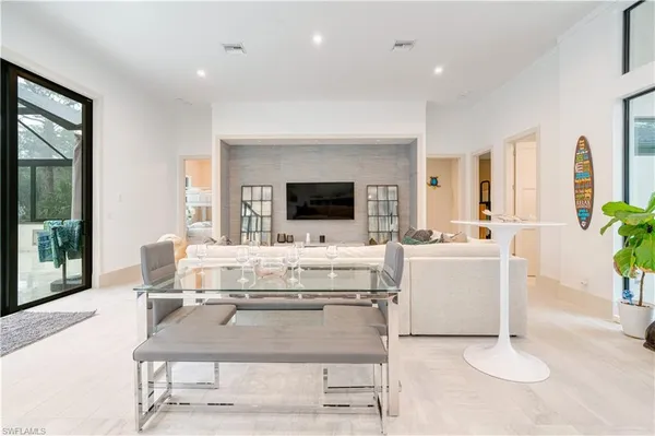 a living room with furniture and flat screen tv
