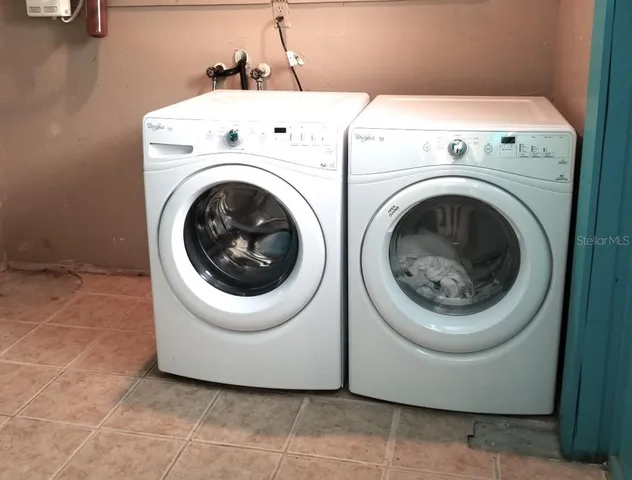 a utility room with dryer and washer