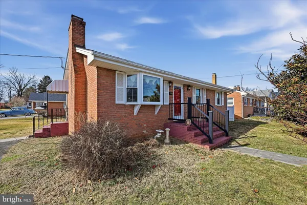 a view of a house with backyard porch and sitting area
