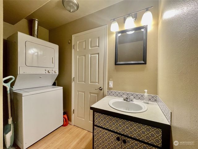 a bathroom with a sink toilet and vanity