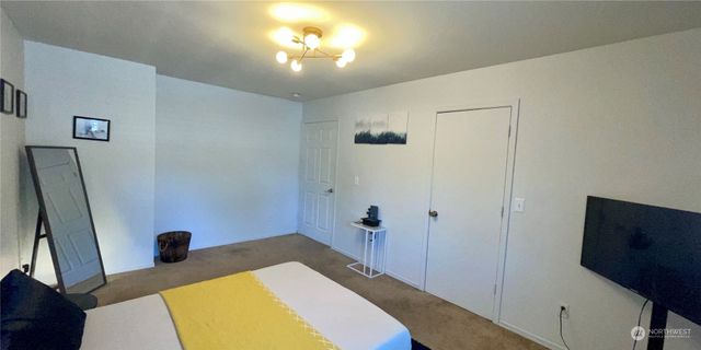 a workspace with furniture and chandelier fan