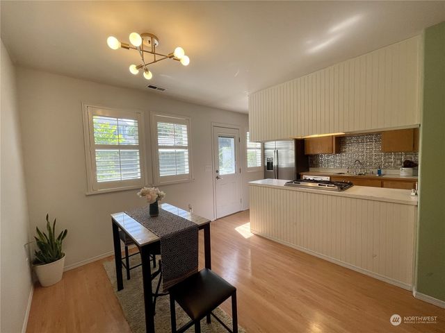 a kitchen with a table and chairs in it