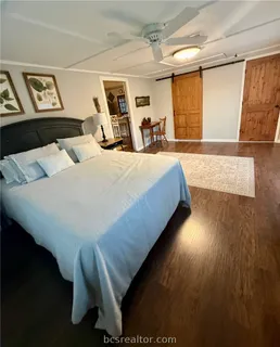 a bed room with a bed window and couch