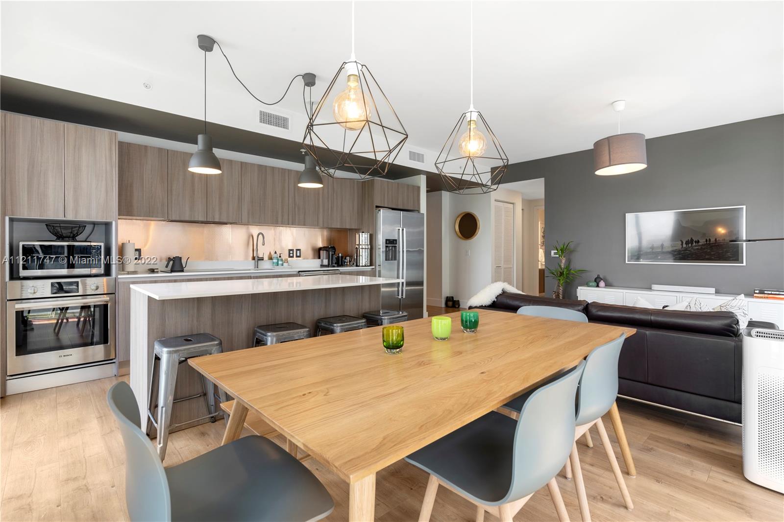 201 Southwest 17th Road, Unit 501 Miami, FL 33129 - Photo 11 of 21 a kitchen with a table and chairs in it