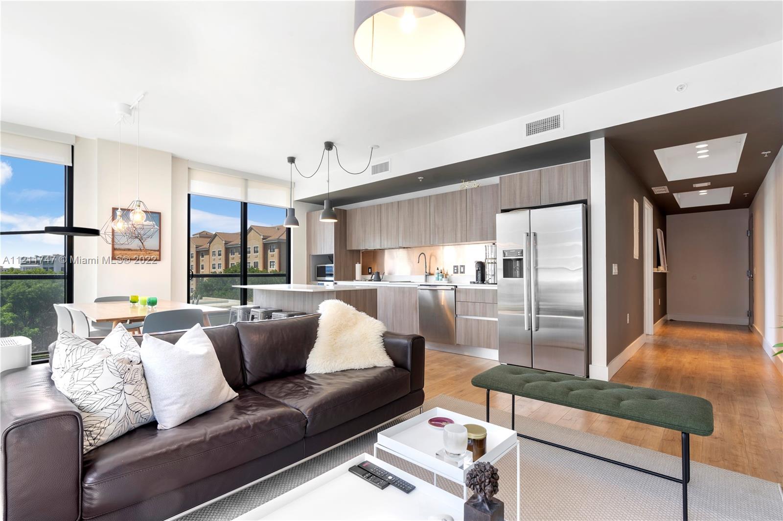 201 Southwest 17th Road, Unit 501 Miami, FL 33129 - Photo 2 of 21 a living room with furniture and a large window