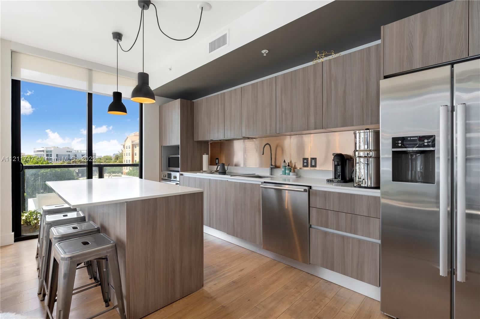 201 Southwest 17th Road, Unit 501 Miami, FL 33129 - Photo 6 of 21 a kitchen with stainless steel appliances granite countertop a refrigerator a sink and a stove