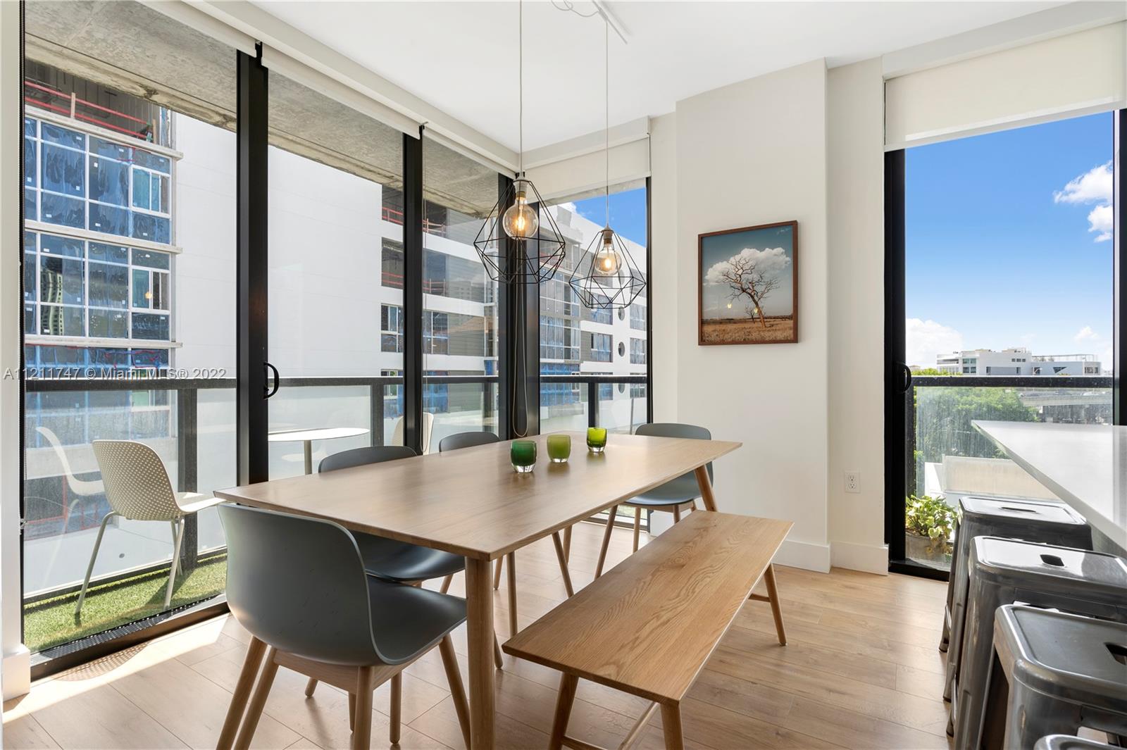 201 Southwest 17th Road, Unit 501 Miami, FL 33129 - Photo 7 of 21 a view of a dining room with furniture window and wooden floor