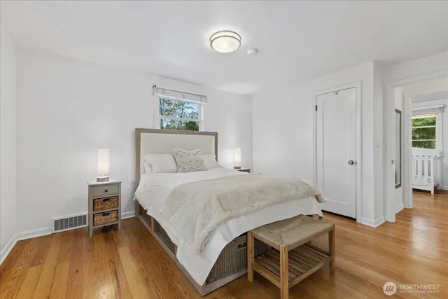 a bedroom with a bed and a table