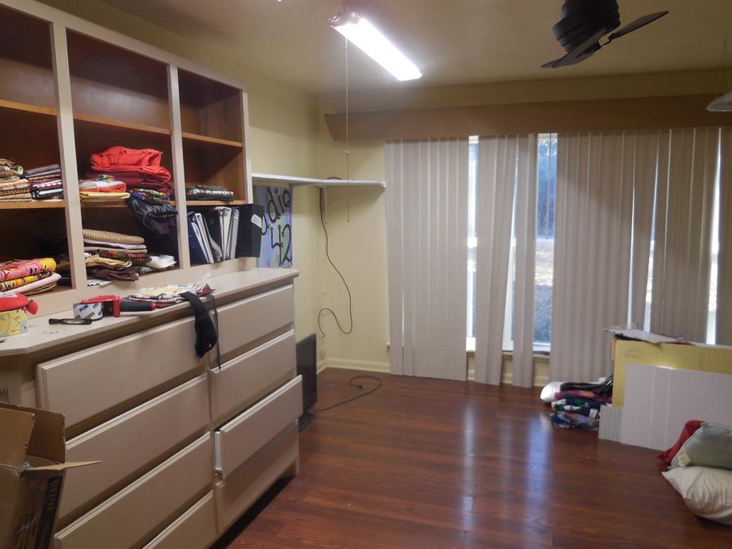 209 Breckenridge Road Ranger, TX 76470 - Photo 11 of 21 a room with furniture and a wooden floor