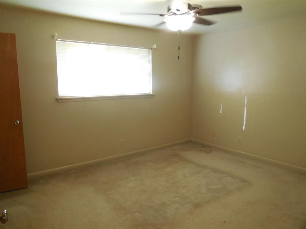 209 Breckenridge Road Ranger, TX 76470 - Photo 16 of 21 an empty room with a window