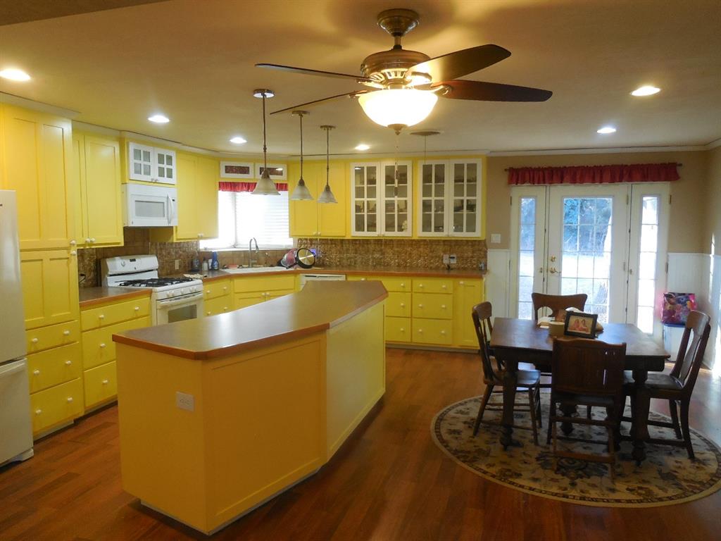 209 Breckenridge Road Ranger, TX 76470 - Photo 5 of 21 a view of a dining room with furniture window and wooden floor