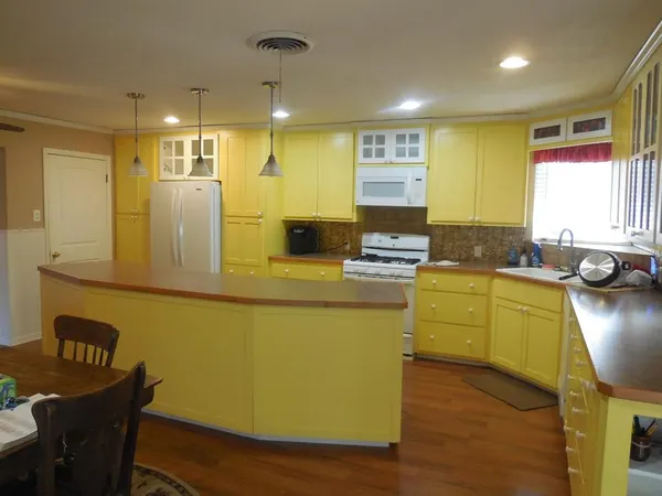 a kitchen with sink and window