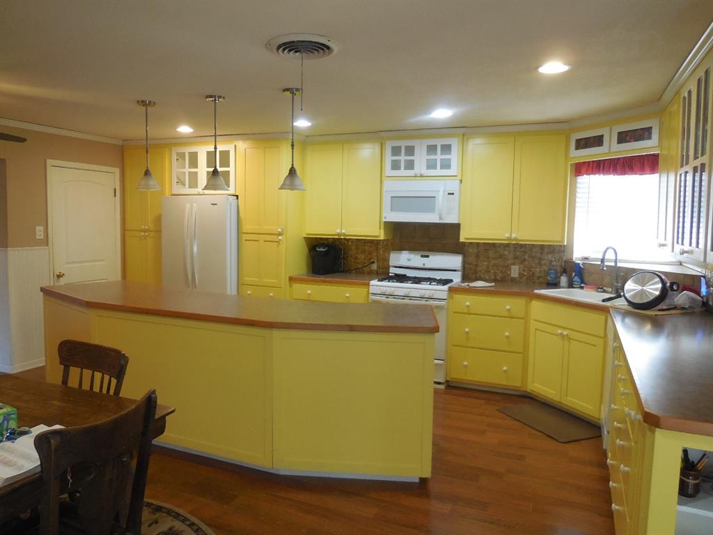 209 Breckenridge Road Ranger, TX 76470 - Photo 6 of 21 a kitchen with sink and window